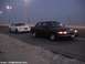 2000 Ford Crown Victoria - Two Ford Crown Victorias are seen on a highway during twilight hours.