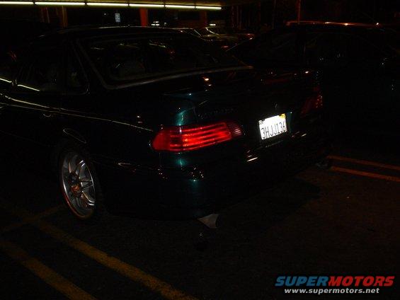 Dark green 1998 Mercury Sable sedan, rear 3/4 view, California license plate 3HJ J136, aftermarket wheels