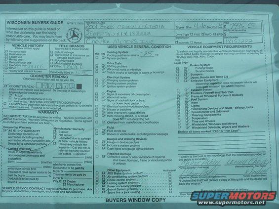 Wisconsin Buyers Guide document with handwritten "2001 Ford Crown Victoria" and "Cheyka Motors Inc."