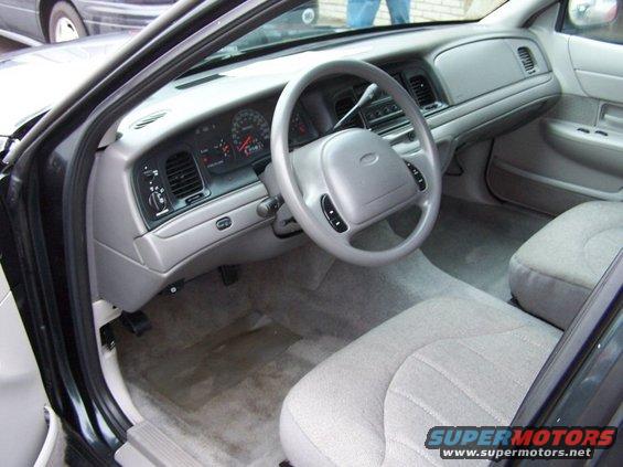 2001 Ford Crown Victoria interior showing dashboard, steering wheel, and front seats
