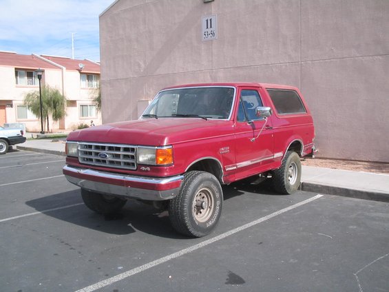 1991 Ford Bronco parked in a lot, front 3/4 view