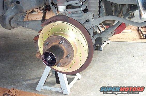 Front brake rotor and hub assembly on jack stands, greased hub
