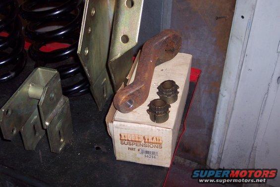 Box of Trail Suspensions parts with rusty metal bracket and coil springs