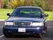 1998 Ford Crown Victoria - This blue Ford Crown Victoria is shown from the front, with a Washington license plate visible.