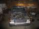 1989 Ford F-150 - Front view of a Ford F-150 truck with its hood open, parked in a garage.