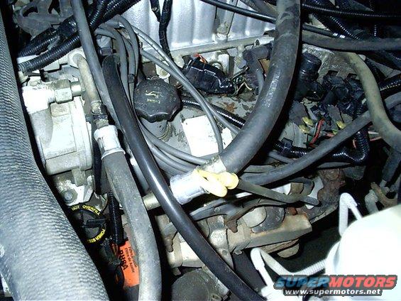Engine bay with hoses and wiring visible. Oil cap reads 'ENGINE'