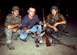1989 Ford Bronco - Three hunters pose with a harvested deer and their rifles.