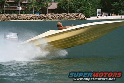 Yellow boat speeding on water with Yamaha outboard motor