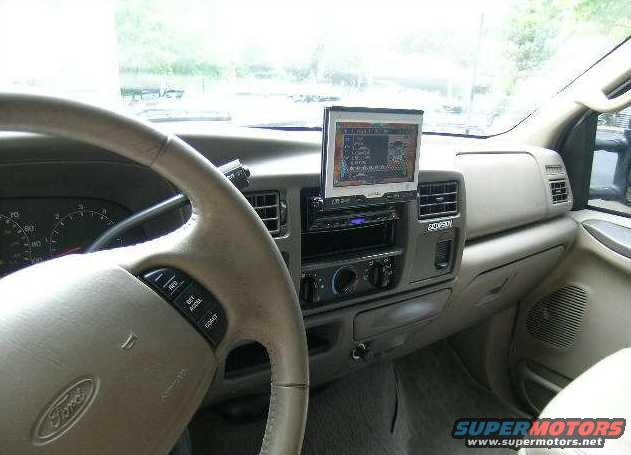 2000 Ford Excursion interior showing steering wheel, dashboard, and GPS unit