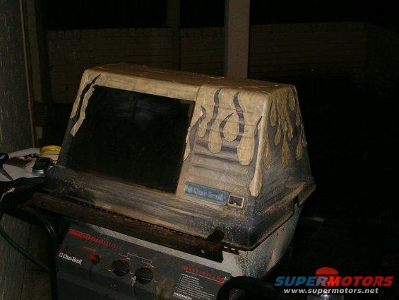 Grill with custom flame decals and a dark screen