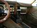 1978 Ford Mustang II - The interior of a 1978 Ford Mustang II shows its brown dashboard, steering wheel, and center console.