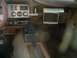 1978 Ford Mustang II - Interior view of a car, a dashboard with gauges and an aftermarket screen.