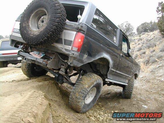 1994 Ford Bronco rear view, off-roading on dirt hill