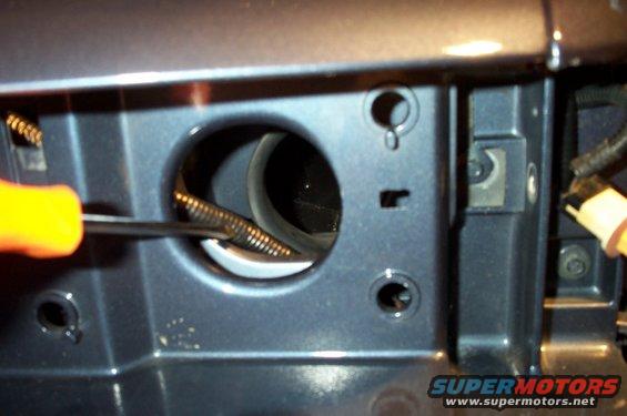 wire-routing-front.jpg Here's a pic of the wire routing, viewed from where the headlights are typically mounted. Again, a screwdriver points to the new wire and it's loom. You can also see the airbox's opening in the background.
