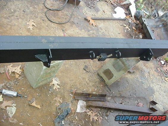 Back side of Rear bumper complete with trailer chain safetey hooks.  It will mount to the frame with 6 Grade 8 5/8" bolts, compared to the stock trailer hitch that mounted to the bottom of the frame with 6 Grade 5 1/2" bolts.