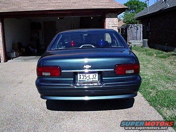 Rear view of a 1993 Chevrolet Caprice with police lights