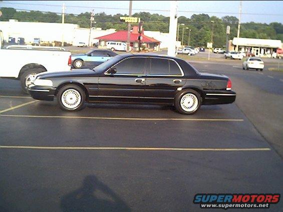 1999 Ford Crown Victoria parked in a lot, side view