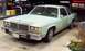 1985 Ford Crown Victoria LTD - A light green sedan is parked at a gas station with a CVS store in the background.