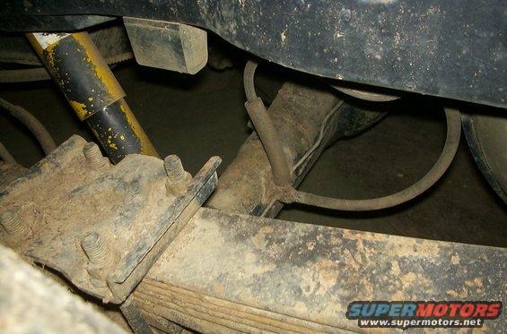 1981 Ford Bronco rear suspension with yellow shock absorber and leaf springs
