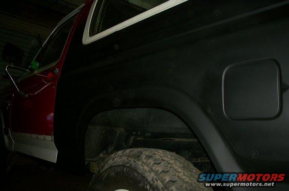 1981 Ford Bronco rear quarter panel, red door, black paint, fuel door, tire