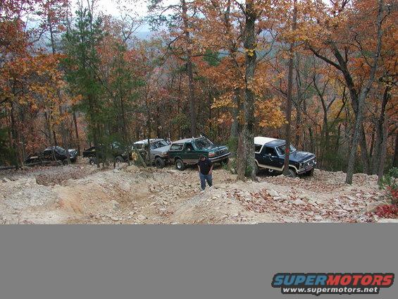 Dark blue 1985 Ford Bronco on rocky trail