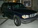 1996 Ford Explorer - This 1996 Ford Explorer is shown in a 3q-front view, its distinctive chrome grille and dark blue paint.