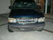1996 Ford Explorer - Dark green Ford Explorer's front end is shown in a driveway.