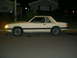 1982 Ford Mustang - This 1982 Ford Mustang is shown from the side, parked on a residential street after dark.