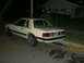 1982 Ford Mustang - A 1982 Ford Mustang coupe is seen from the rear, parked on a residential street at night.