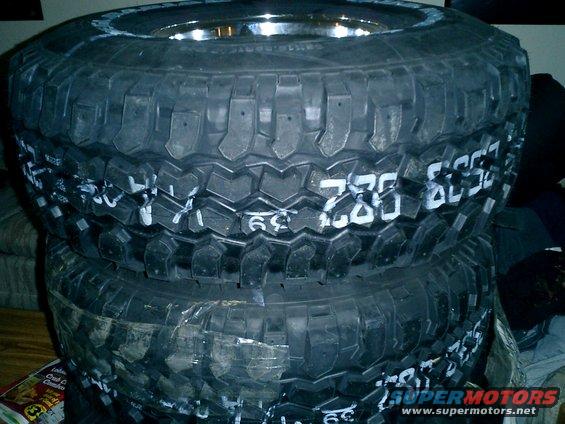 Stack of three off-road tires with white markings including '285/75R16' and '39'