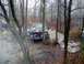 1979 Ford Bronco - Off-road vehicles tackle a muddy path in a wooded area during an overcast day.