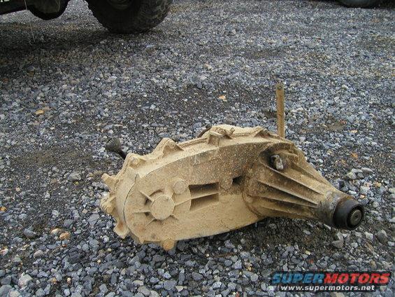 Tan transfer case with two shifters on gravel