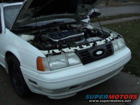 1990 Ford Taurus front view, hood open showing engine bay