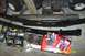 1996 Ford Bronco - Various automotive parts are displayed, including leaf springs and ignition components.