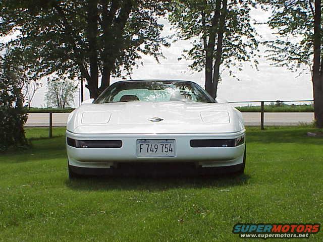 White 1994 Chevrolet Corvette parked on grass, front view. License plate F 749 754