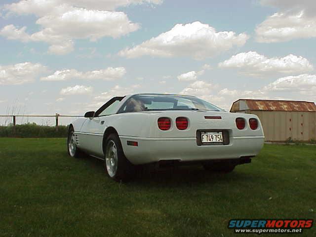 White 1994 Chevrolet Corvette convertible, rear view, with a license plate reading F 749 754