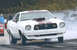 1976 Ford Mustang II - This 1976 Ford Mustang II is set up for drag racing, a prominent hood scoop and racing stripes.