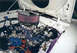 1976 Ford Mustang II - The engine bay of a 1976 Ford Mustang II, a prominent purple air filter and custom wiring.