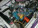 1976 Ford Mustang II - Close-up of a V8 engine in a vehicle's engine bay, with various components and wiring.
