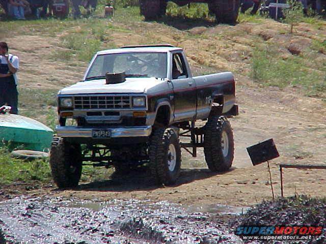 Lifted 1987 Ford Ranger with custom hood scoop and large tires