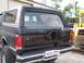 1989 Ford Bronco - The rear of a black Ford Bronco is shown with a spare tire mount and a Virginia license plate.