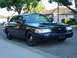 1999 Ford Crown Victoria - September 28, 2004 Passenger side front low far view.