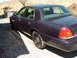 1999 Ford Crown Victoria - September 21, 2004 Driver's side far rear view in the driveway