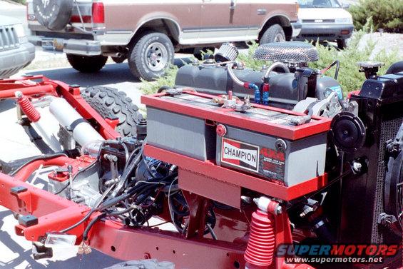 How about a custom dual battery cage (now replace with a similar fabbed unit for two Optima red-top gel-cells, YES!)