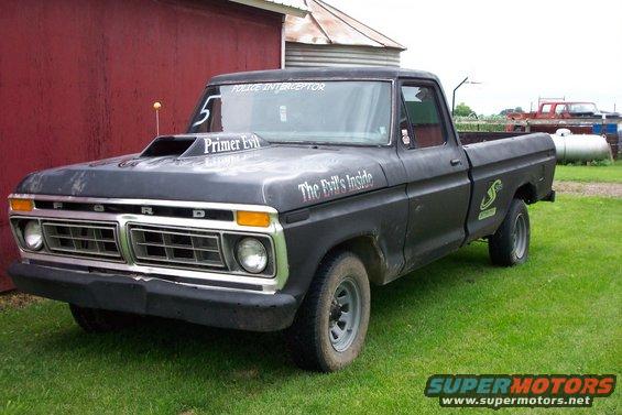 Black 1977 Ford F-150 with hood scoop and 'The Devil's Inside' decal