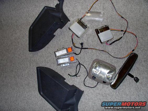 img_0171.jpg Last Friday's junkyard score; 2 crack free seat belt cover panels, 2 Chrysler Fifth Ave dome lights, 2 Lincoln door panel lights, 1 Areostar dome light, spare Taurus dome light lense and mint Bronco rear view mirror with glass mount. $15 CDN or $10.50 American.