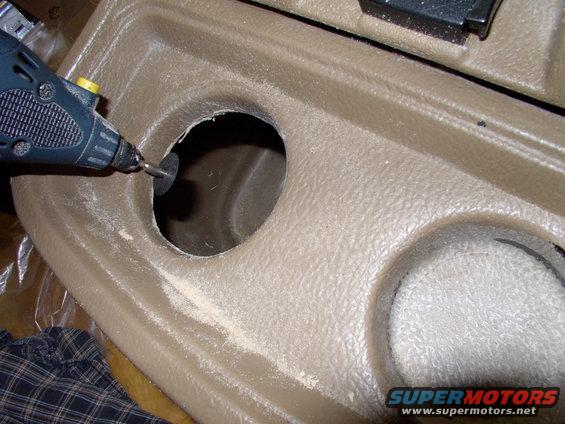 img_0211.jpg Now cut out the plastic with a dremel or by hand with a carpet knife, but be warned this is very thick plastic in this area.