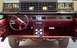 1985 Ford Crown Victoria LTD - The front grille and interior of a Ford Crown Victoria are shown, with a focus on the dashboard and steering wheel.