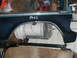 1979 Ford Bronco - A dark blue fender, possibly from a 1979 Ford Bronco, is shown with the word 'PASS' written on it.