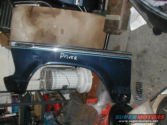 Dark blue fender with chrome trim and a blue stripe, labeled "Driver"